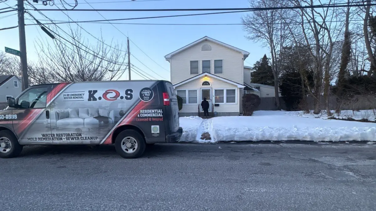 K.O.S. van outside a Patchogue home after a frozen pipe burst in winter