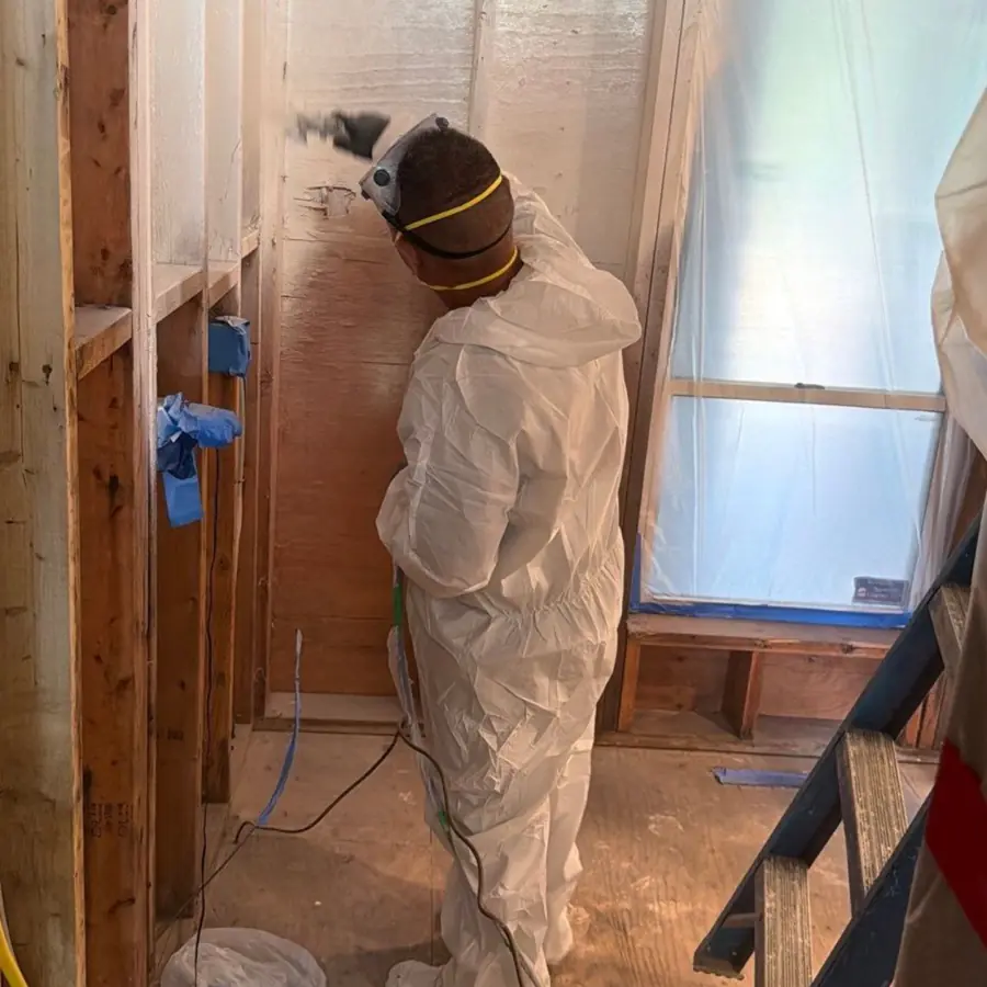 Applying encapsulant to cleaned framing in a Westhampton Beach condominium