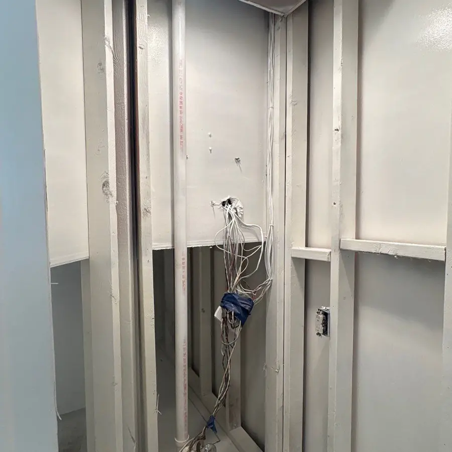 Sealed stud bay after encapsulation, wiring secured