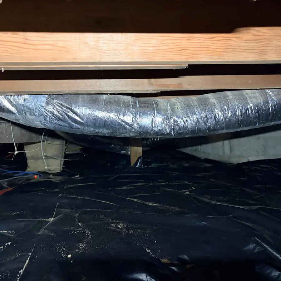 New vapor barrier installed across the crawlspace