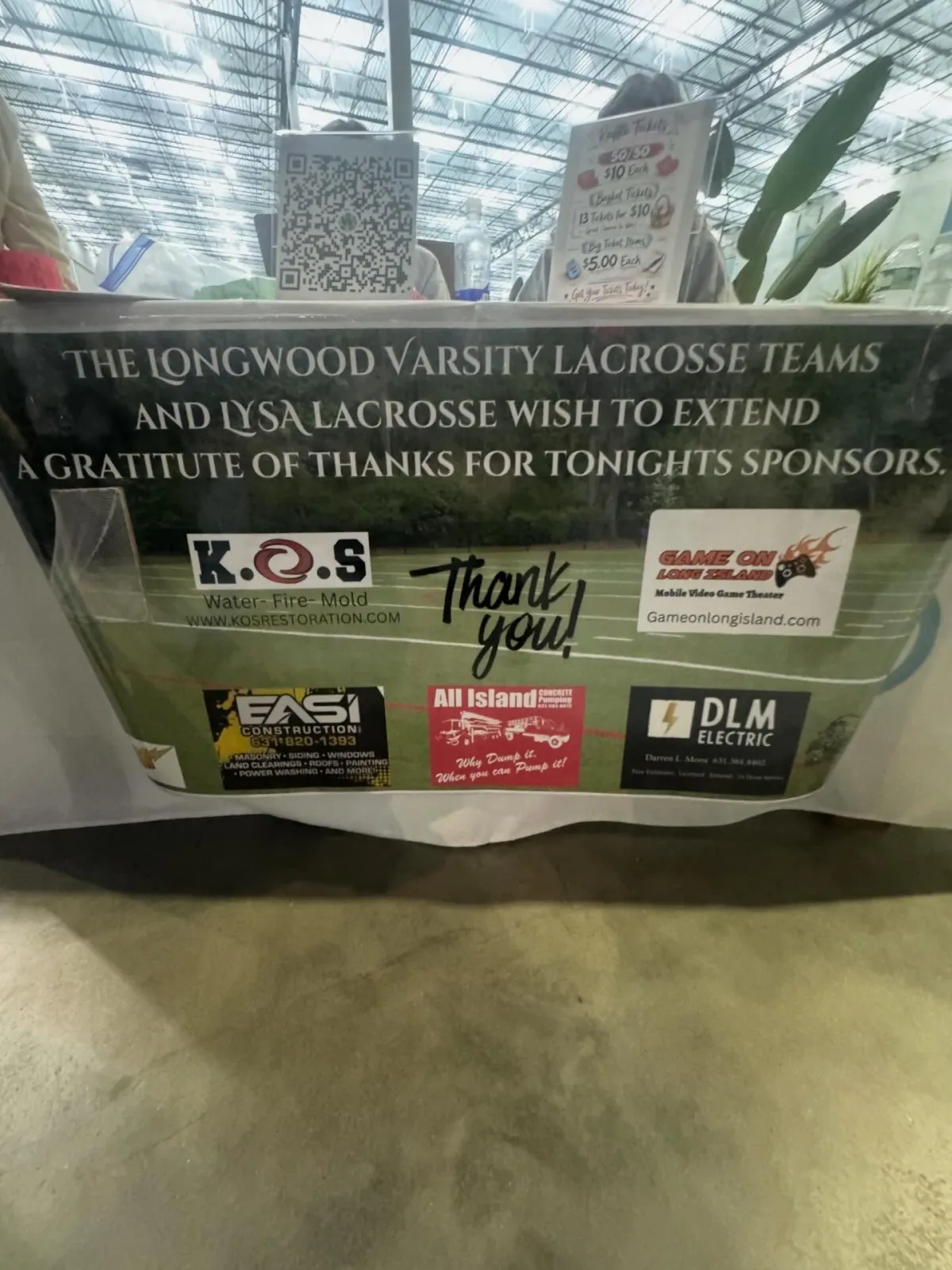 Longwood Varsity Lacrosse and LYSA Lacrosse banner thanking K.O.S. Restoration and the night's sponsors