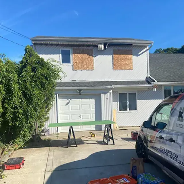 Boarded windows with the K.O.S. van on site