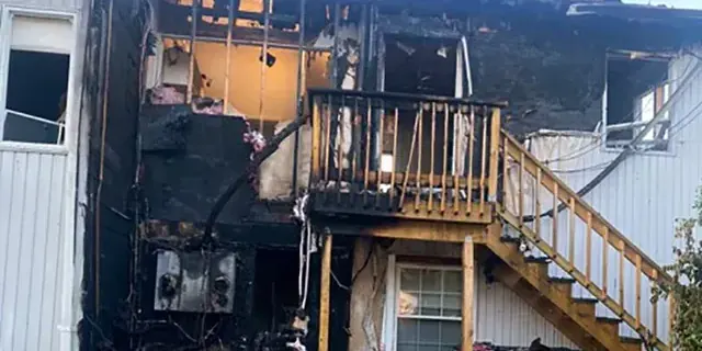 Rear of a Long Island home after a structure fire, before board-up