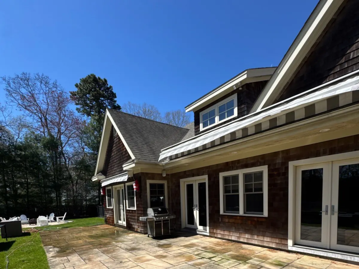 Back of a Westhampton cedar shake home with darkened siding before cleaning