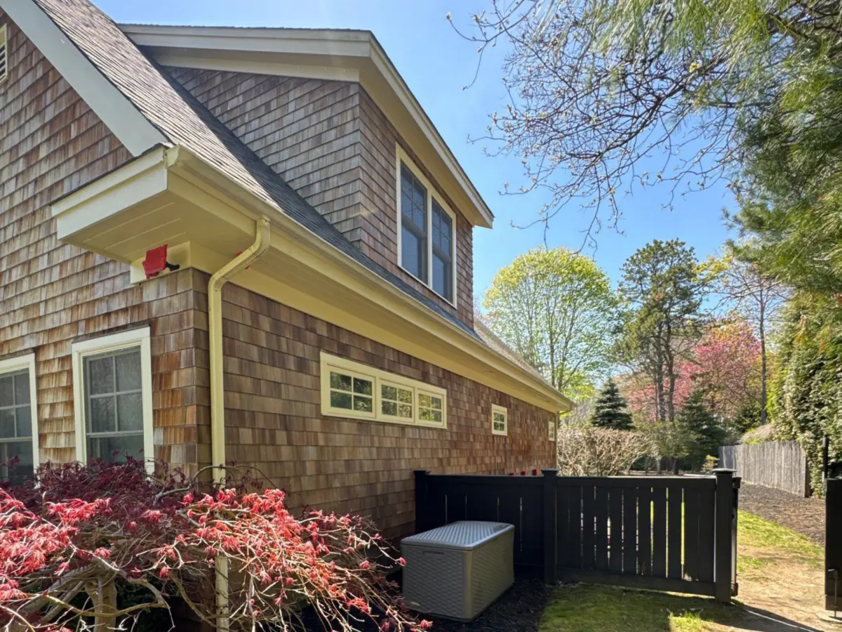 Side of the Westhampton cedar home after soft washing