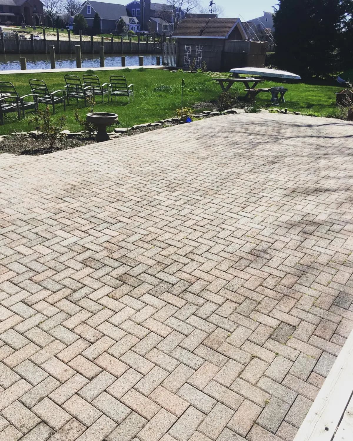 The same herringbone paver patio clean and bright after pressure washing