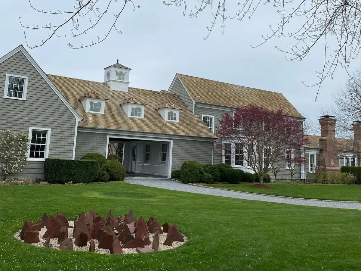 Cedar-shingle Long Island home with a freshly cleaned roof