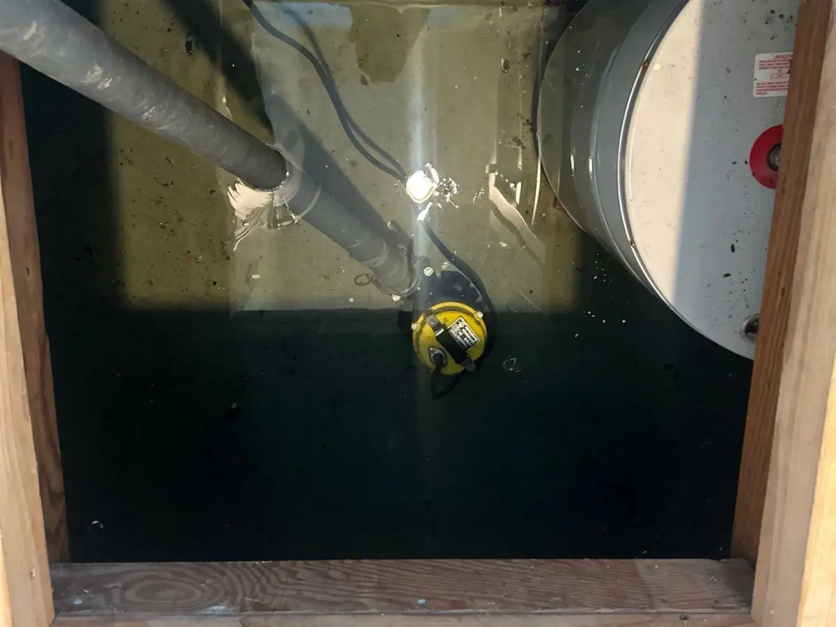 pumping flood water from crawlspace at home in East Hampton NY