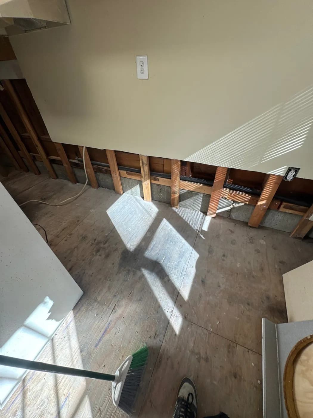 Clean wall cavities and subfloor after water damage restoration in Greenlawn NY