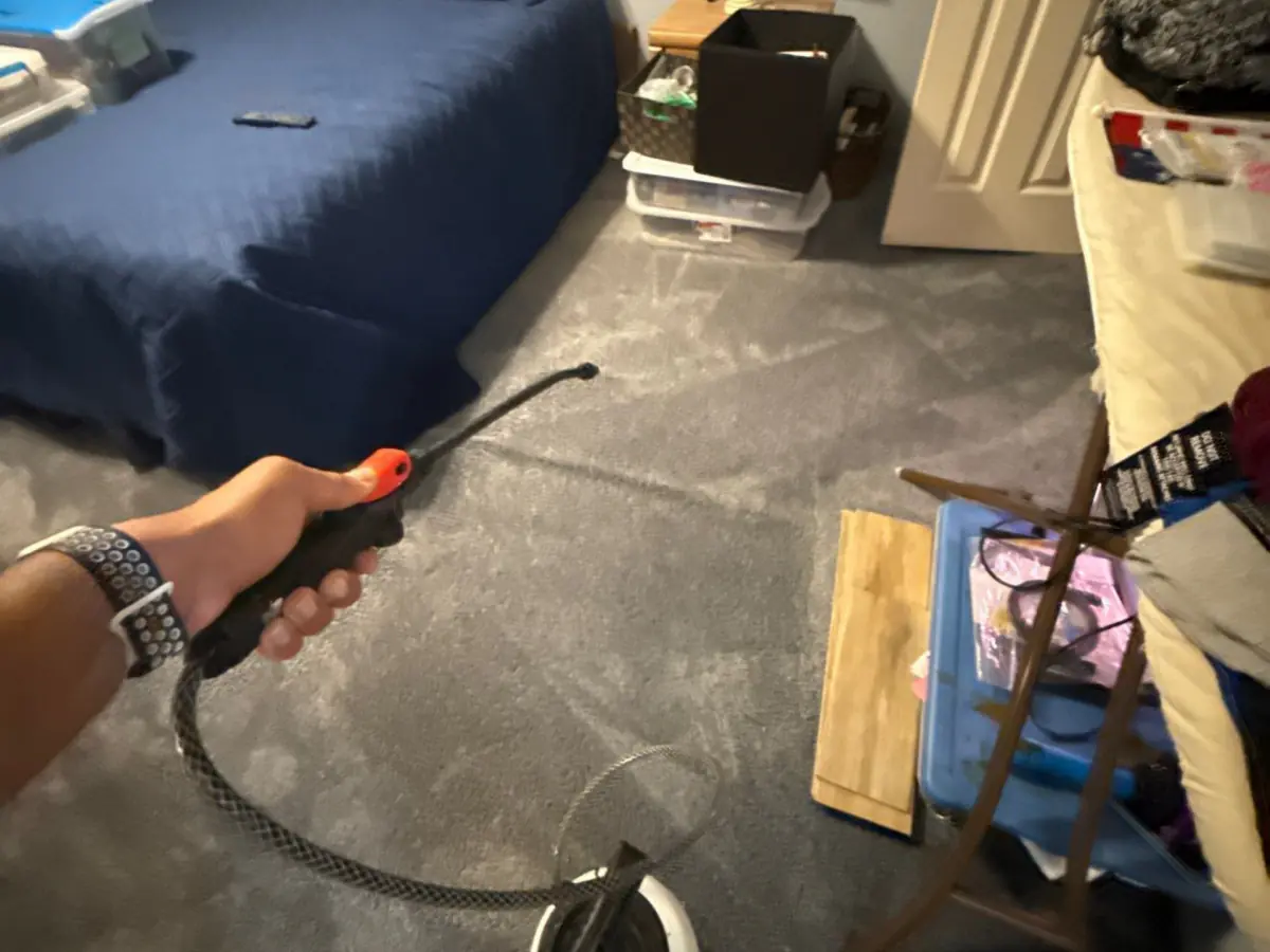 Moisture probe testing the bedroom carpet after extraction