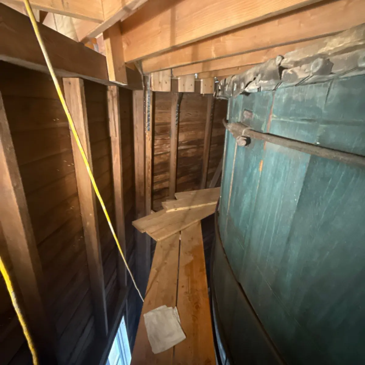 Cleaned walkway along the curved green wall inside the windmill