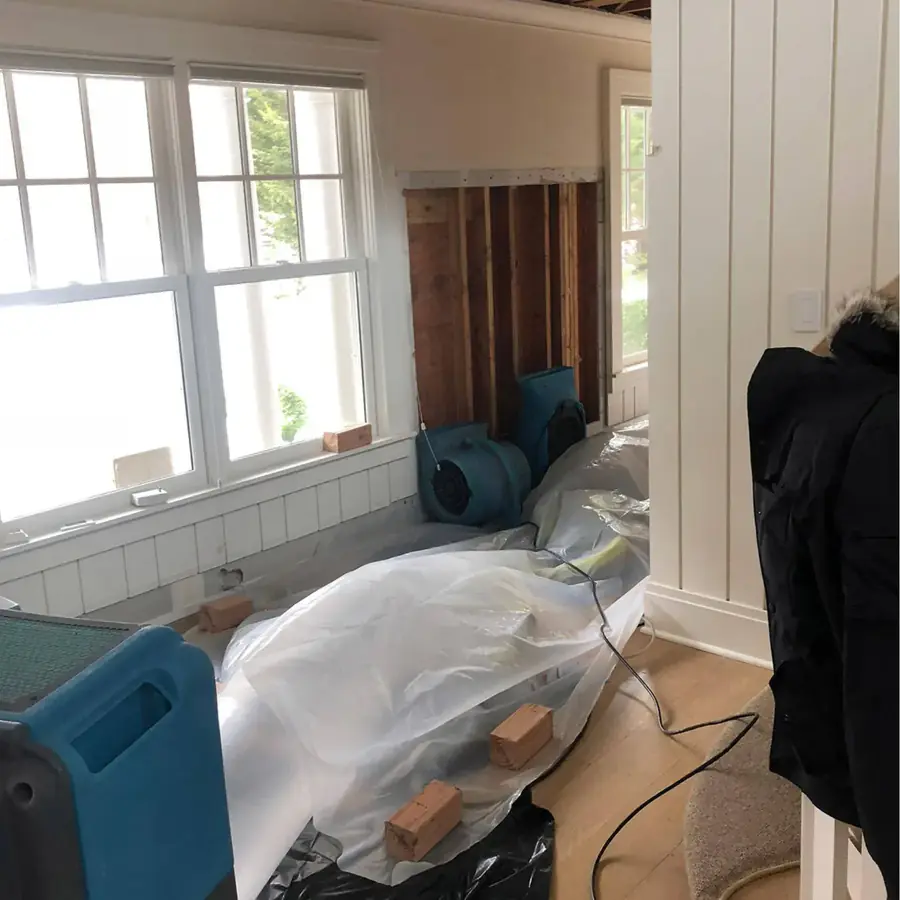 Drying equipment in a stripped room after a sewage loss